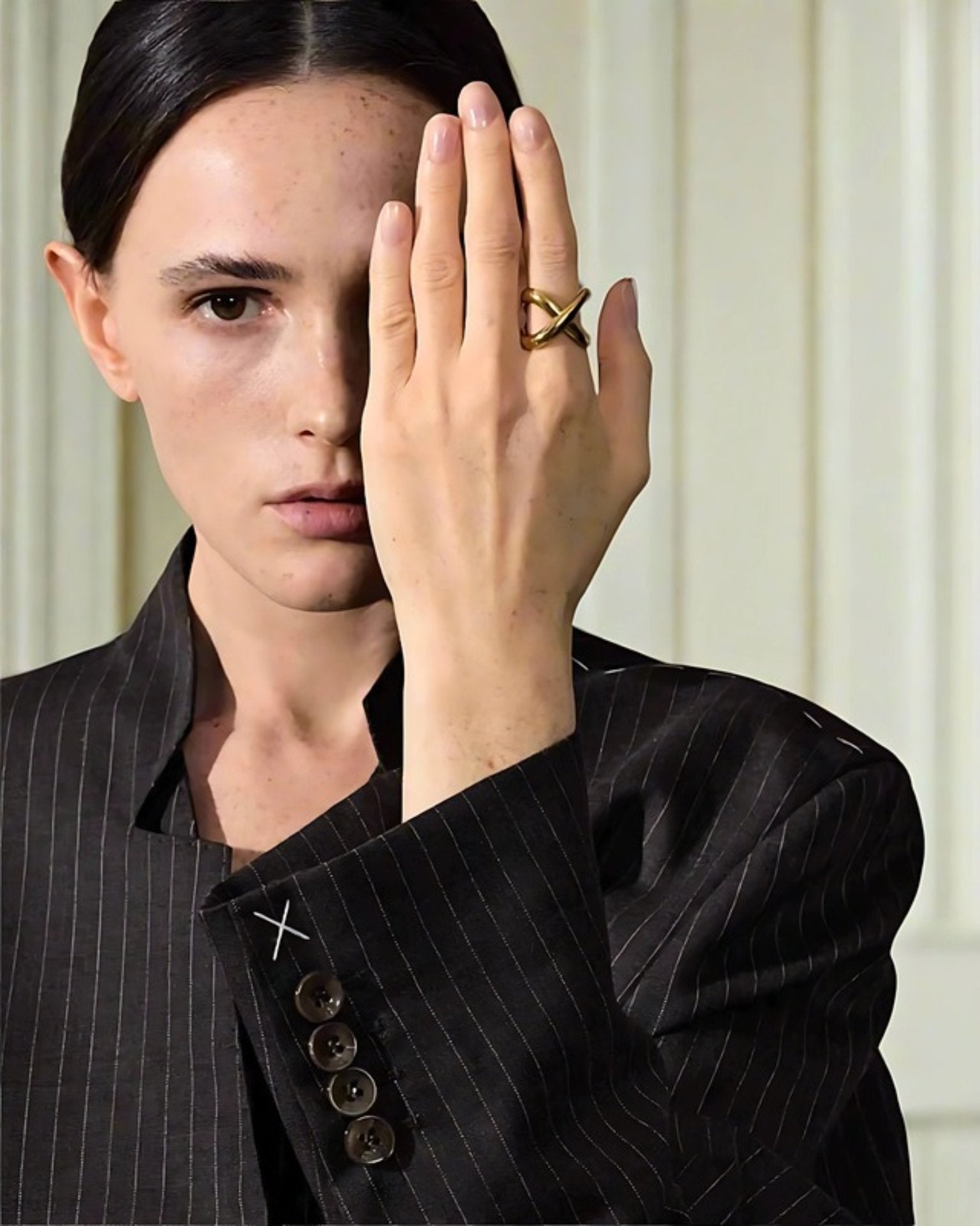 Elegant, young woman models Geometric Crossover Statement Ring, angle 2