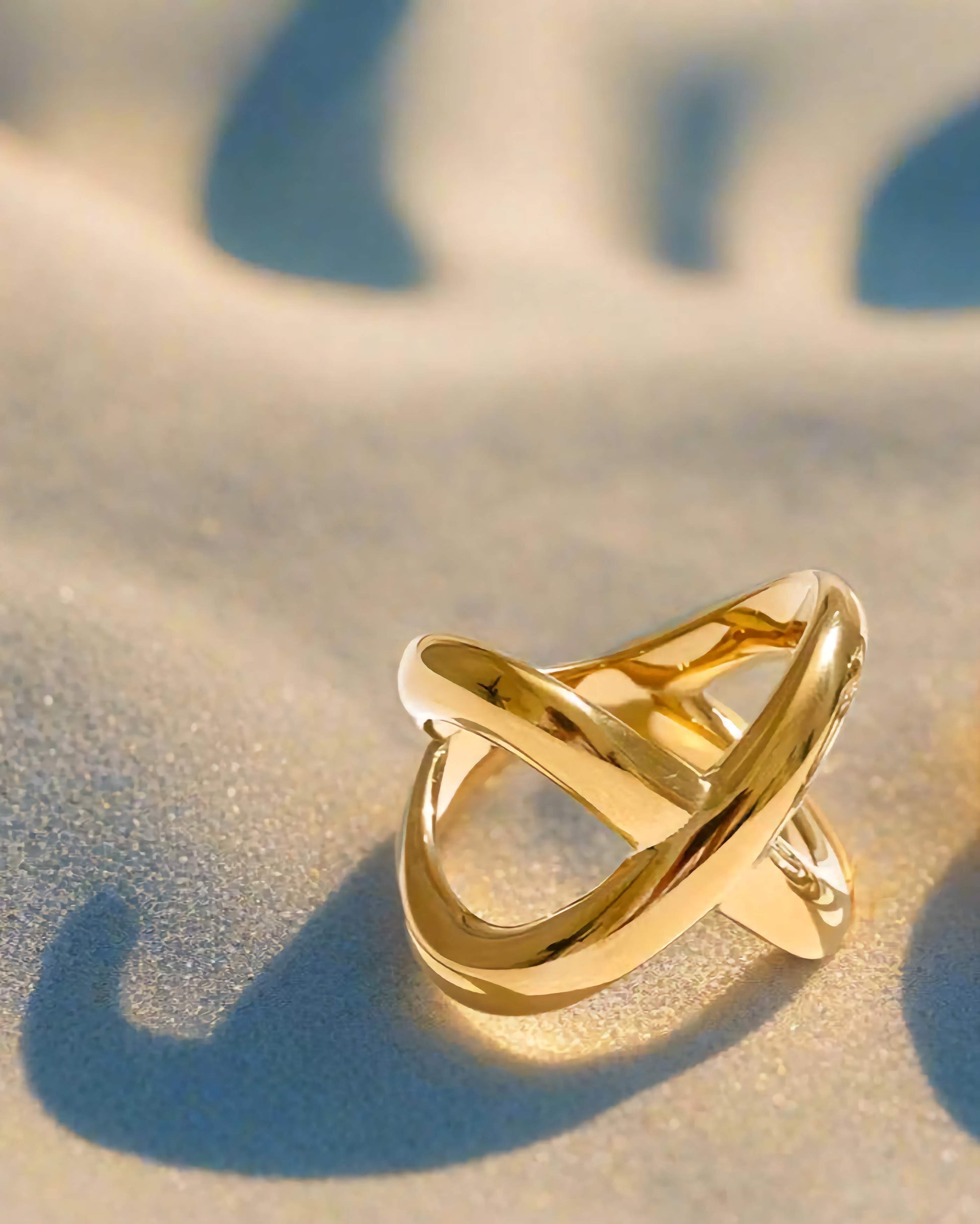 Gold and Silver Geometric Crossover Statement Ring, on white background
