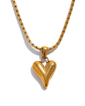 Gold Asymmetrical Heart Pendant Necklace, snake chain variant, on white background