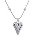 Silver Asymmetrical Heart Pendant Necklace, station chain variant, on white background