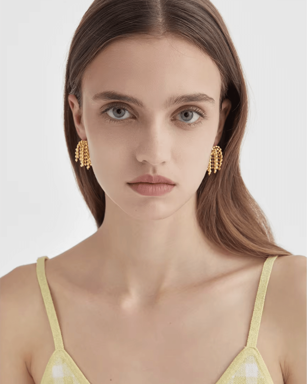 Gold Cascading Ball Chain Drop Earrings against white backdrop