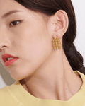 Young woman wearing Gold Cascading Ball Chain Drop Earrings, right