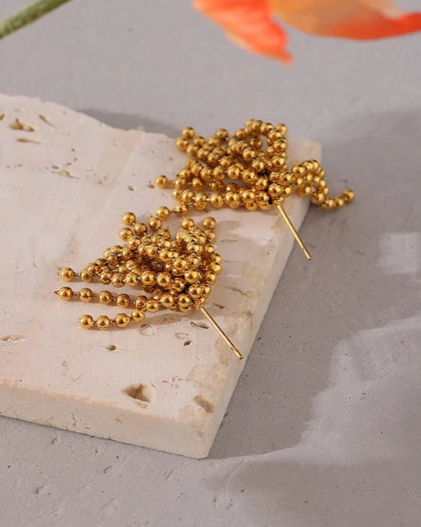 Gold Cascading Ball Chain Drop Earrings, on limestone