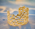 Gold Coral Motif Statement Cuff, on display angle 3