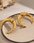 Gold Crescent Moon Earrings on display 3