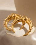 Gold Crescent Moon Earrings on display 1