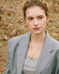 Stylish young woman models old Crescent Moon Earrings, portrait 