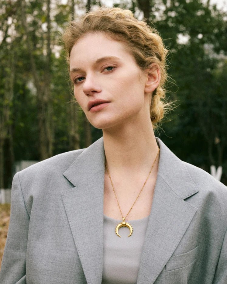 Gold Crescent Moon Pendant Necklace, on white background