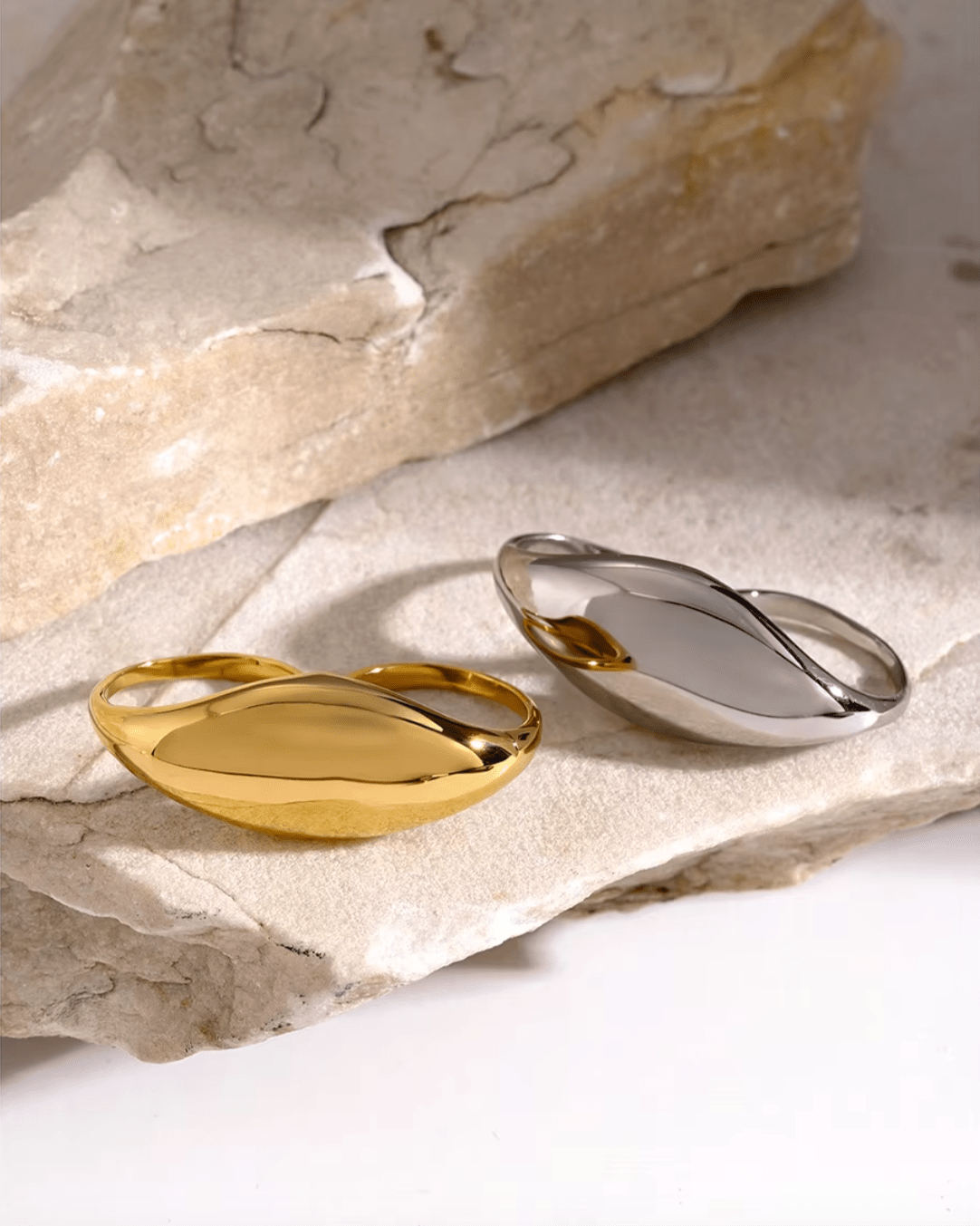 Gold and Silver Dome Statement Double Ring, displayed on limestone