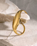 Gold Dome Statement Double Ring, displayed on limestone