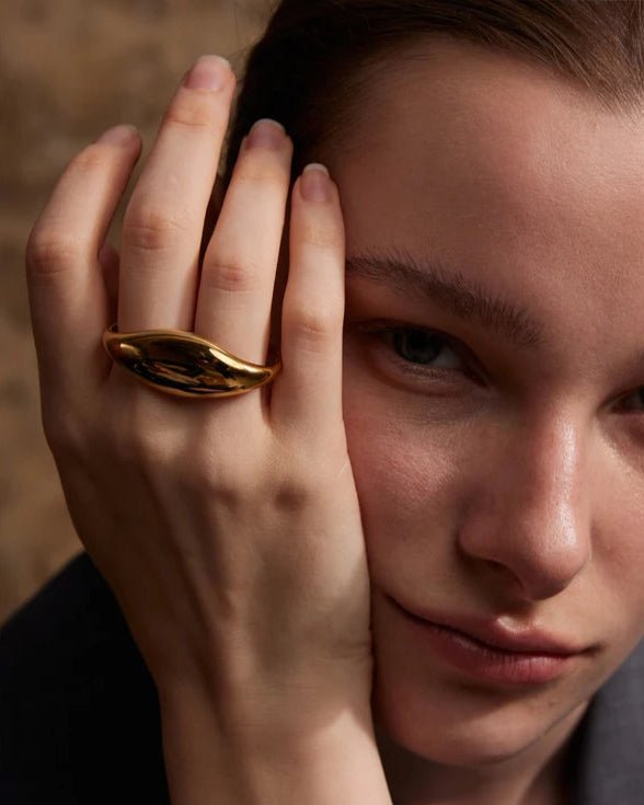 Elegant woman modeling Gold Dome Statement Double Ring, close up