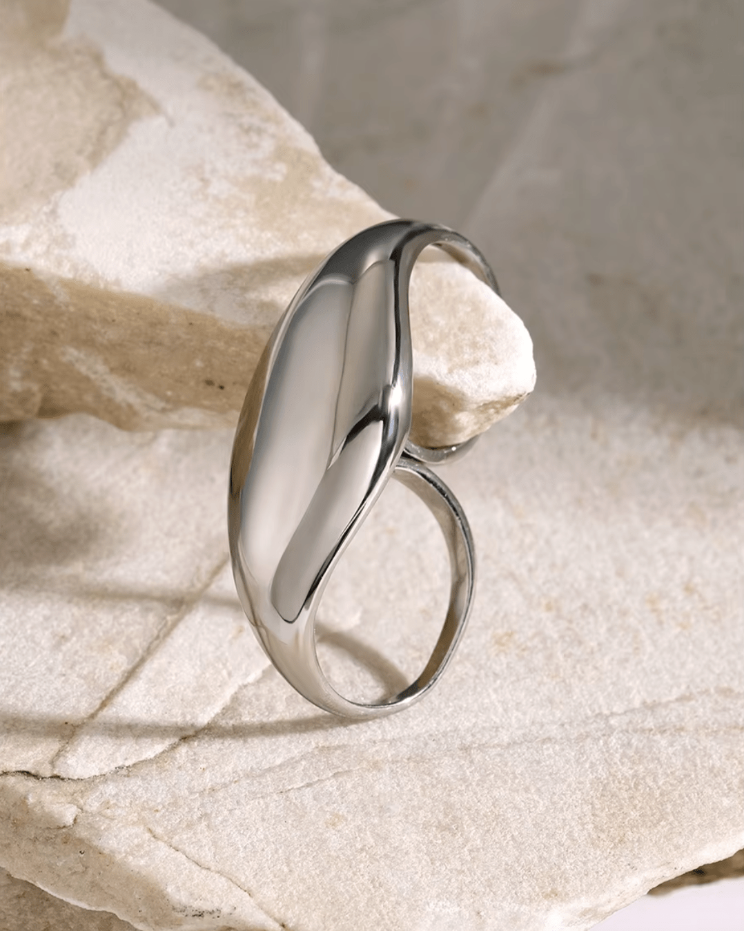 Silver Dome Statement Double Ring, displayed on limestone