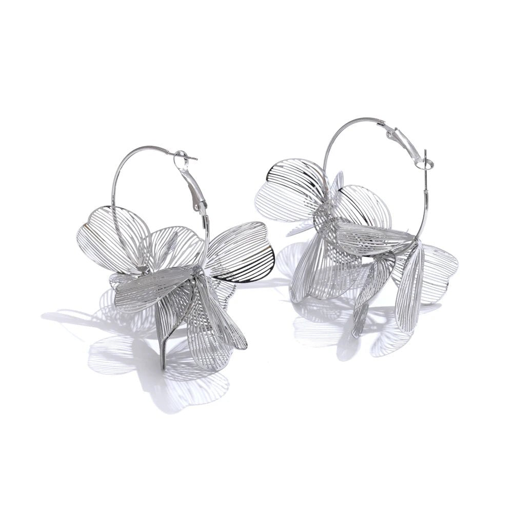 Silver Flower Motif Hoop Earrings against white background