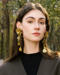 Elegant, young woman, models Gold Flower Motif Statement Earrings, angle 4