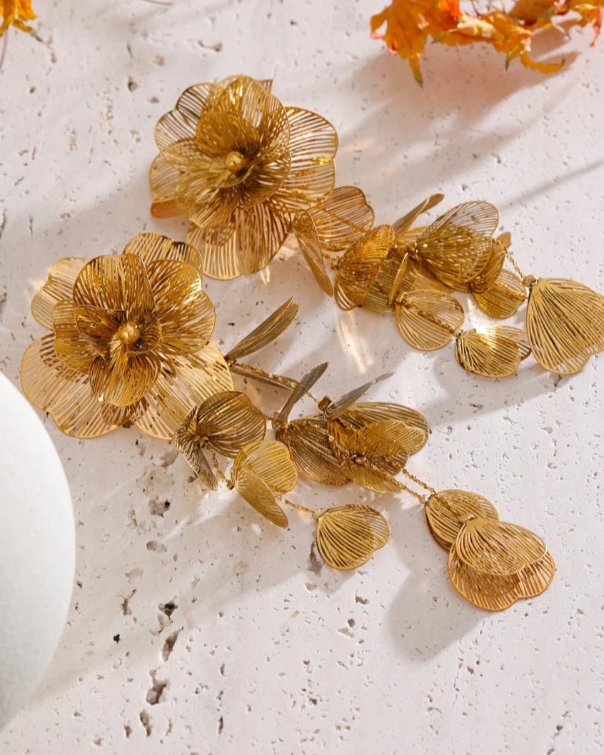 Gold Flower Motif Statement Earrings, on display angle 1