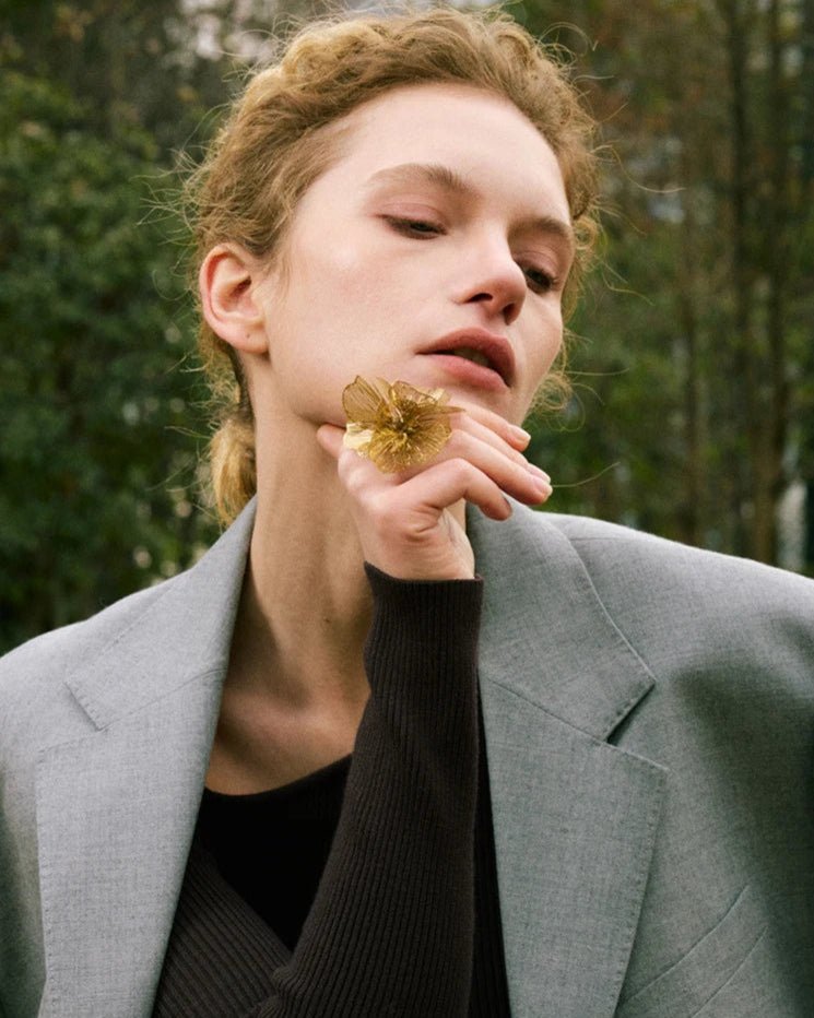 Gold Flower Motif Statement Ring, on white background