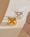 Gold and Silver Geometric Crossover Statement Ring, on limestone display 2