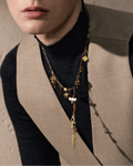 Young elegant model wears Lariat Multi-Colored Charm Necklace, close up