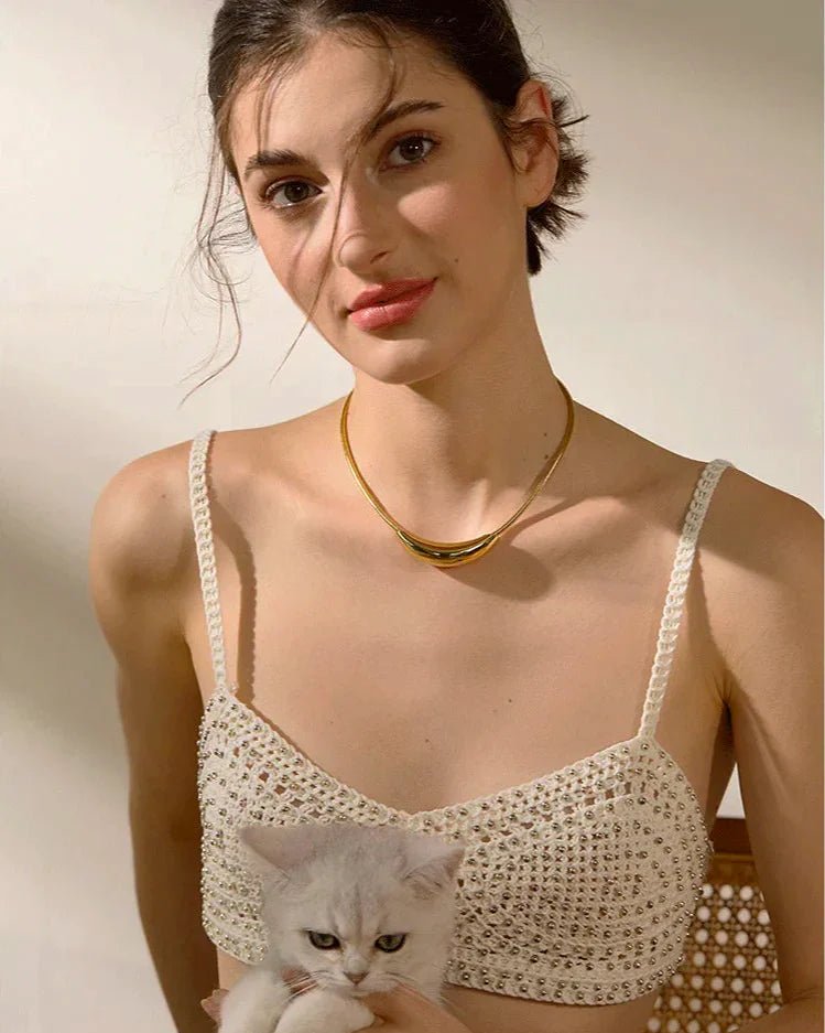 Young Woman modeling Gold Vintage-Inspired Collar Necklace while holding cute cat